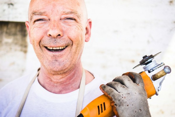 Man Holding Orange Angle Grinder 7329D77a71ff6bcacc261199e87f9df4